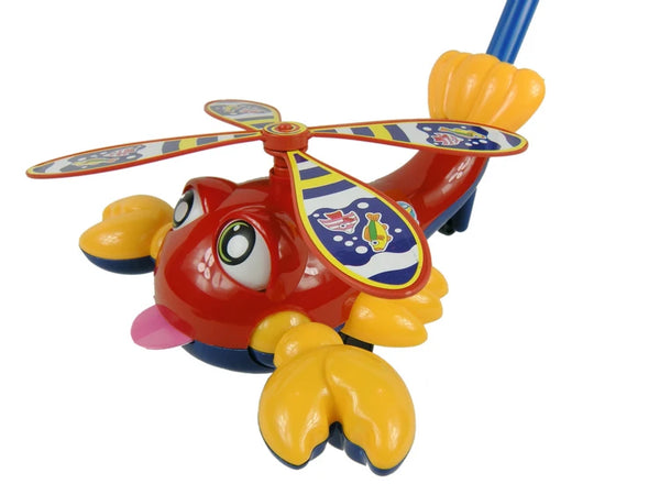 A bright red and yellow kids' push plane toy featuring a propeller and tongue ring attachments.