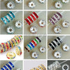 A collection of various crystal and gemstone round spacer beads for jewelry making in different colors and cuts.