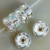 A string of crystal rondelle spacer beads for jewelry making is shown next to two individual beads.