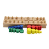 A set of wooden cylinder blocks in various colors including blue, green, and red stacked on a light wood base.