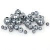 A collection of gray imitation pearl beads in various sizes and finishes.