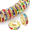A close-up of a string of colorful crystal rondelle spacer beads for jewelry making
