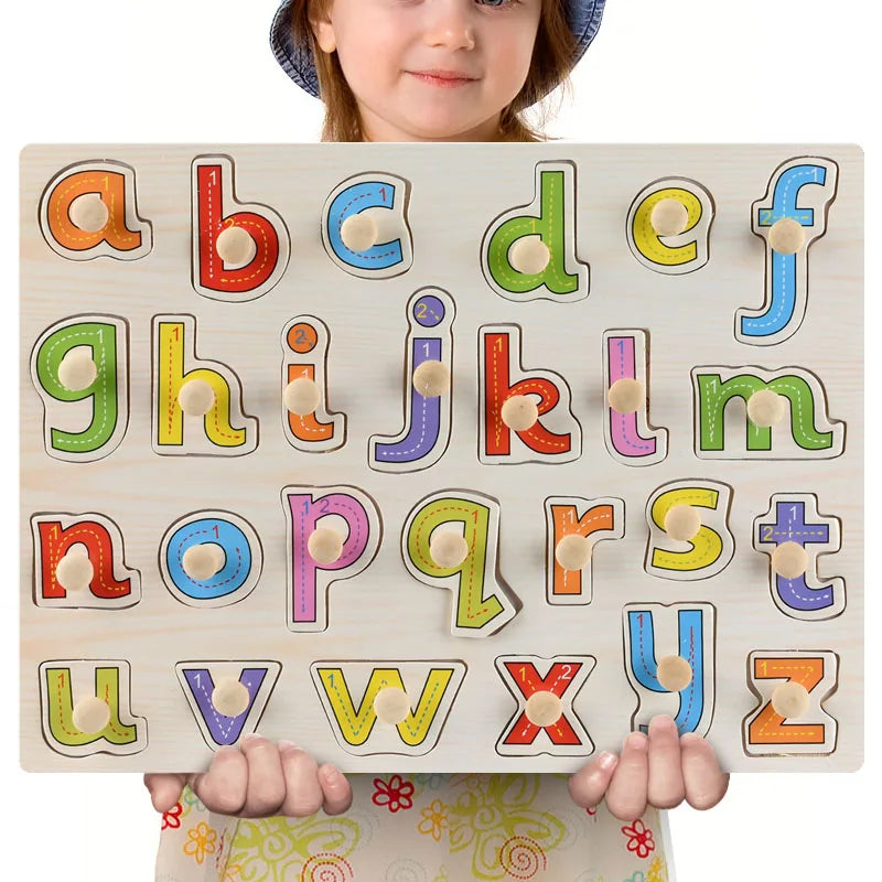 A wooden puzzle set featuring letters and some numbers for toddlers, held by a child.