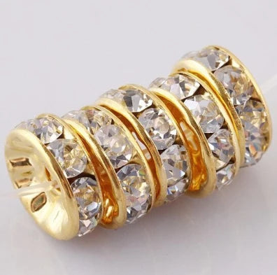 Gold-toned rings of crystal rondelle spacer beads for jewelry making