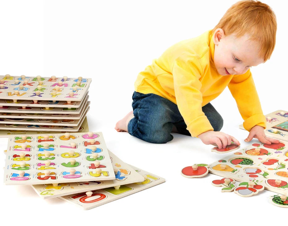 A toddler is interacting with a wooden puzzle set featuring animals, fruits, and shapes.