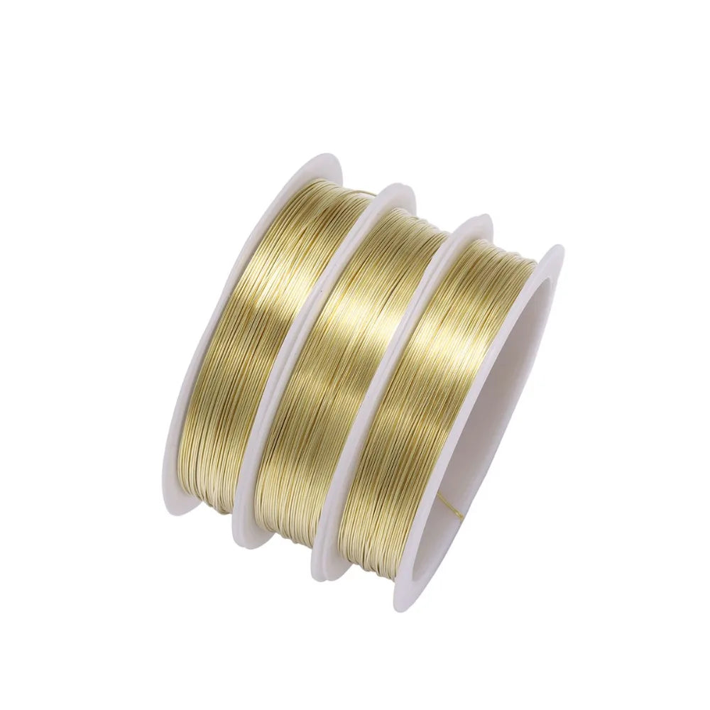 A spool of gold-colored durable copper beading wire for jewelry making.
