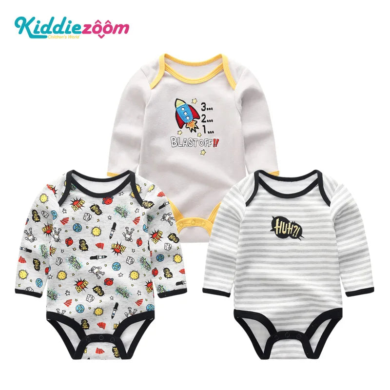 A set of three white cotton baby bodysuits with long sleeves and yellow trim