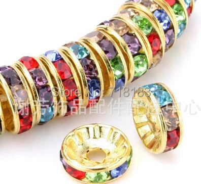 A close-up of a string of colorful crystal rondelle spacer beads for jewelry making