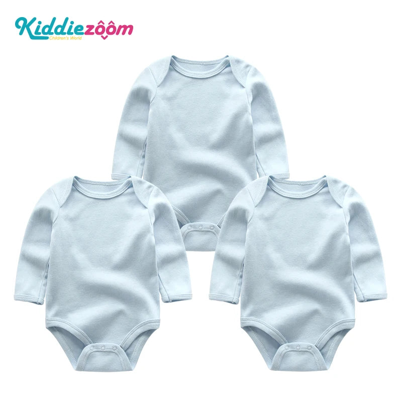A set of three light blue cotton baby bodysuits with long sleeves for infants.