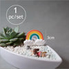 One set of miniature animal figurines for fairy gardens displayed in a white bowl with decorative gravel.