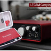 A red carrying case for the Focusrite Scarlett 2i2 USB Audio Interface is shown open on a dark surface.