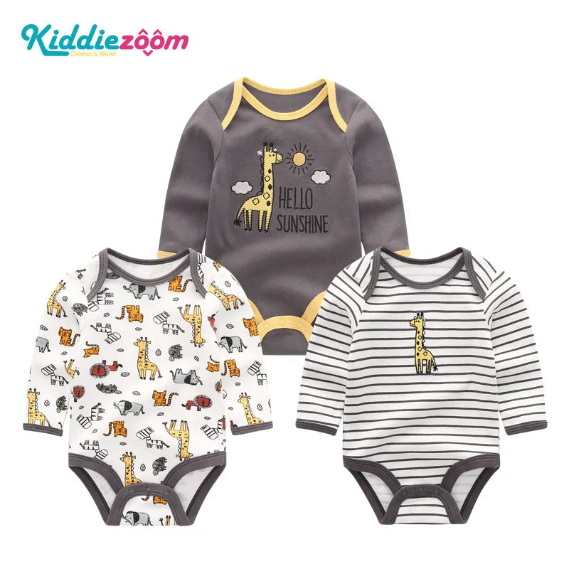 A set of three cotton baby bodysuits with long sleeves featuring a dinosaur design and striped patterns.