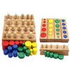 A set of wooden cylinder blocks in various colors including red, blue, green, and yellow for educational play.