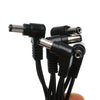 A bundle of black guitar pedal daisy chain cables with various connectors and a 3/4/5/6-way output.