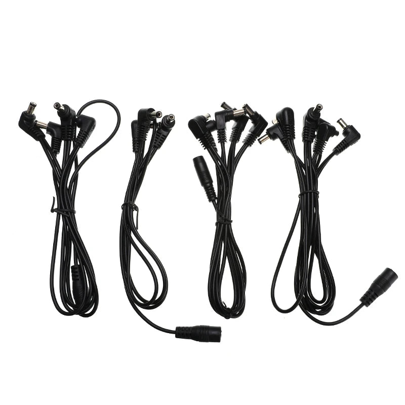 A set of guitar pedal power daisy chain cables with various connectors.