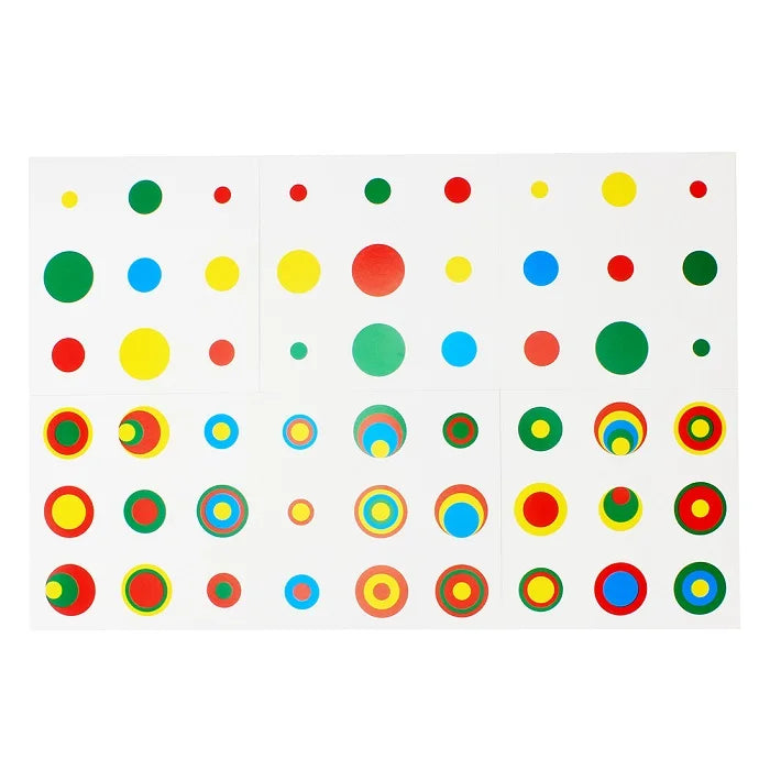 A set of colorful wooden cylinder blocks for educational play featuring various colors and patterns.