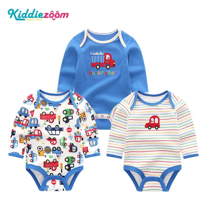 A set of three cotton baby bodysuits for boys featuring a truck design.