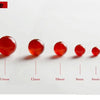A row of natural red carnelian round beads showing various sizes from 1mm to 4mm.