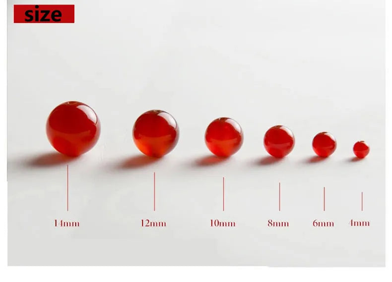 A row of natural red carnelian round beads showing various sizes from 1mm to 4mm.