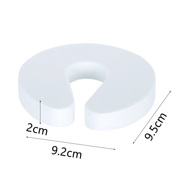 White foam EVA door stopper with dimensions 9.5cm high and 9.2cm wide.