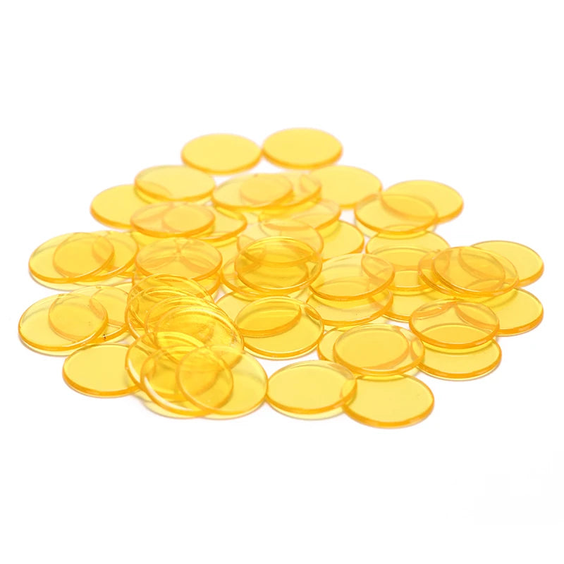 A pile of small, round, yellow plastic bingo chips for games and classrooms.