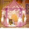 A pink foldable kids castle play tent with sheer fabric draping and glowing lights, featuring a bear and bunny toy.