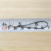 A silver lobster clasp keychain charm is displayed against a ruler marked with numbers 1 through 7.