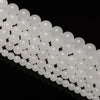 A string of natural white crystal quartz round beads for jewelry making