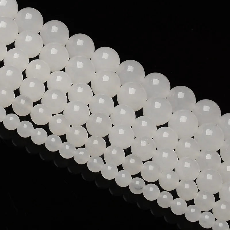 A string of natural white crystal quartz round beads for jewelry making