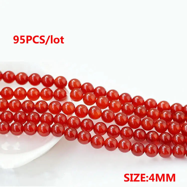 A string of 95 round natural red carnelian beads for jewelry making, with a size of 4mm.