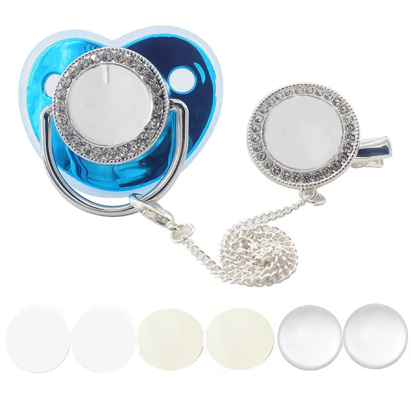A set of baby pacifiers and clips with rhinestone accents, including silicone pacifiers and metal clips.
