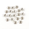 A collection of silver Tibetan style hollow flower bead caps for jewelry making.