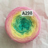 A ball of rainbow gradient mercerized cotton cake yarn labeled A298 on pink paper.