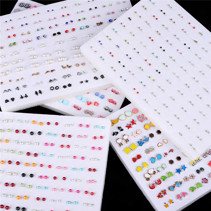 A collection of assorted acrylic stud earrings featuring hearts, stars, and moons in various colors and styles.