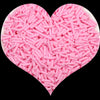 A heart-shaped mound of pink soft polymer clay candy sprinkles for cake decorating