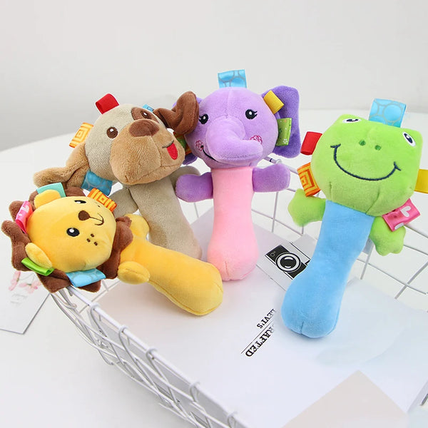 Three plush wrist rattles featuring a rabbit, lion, and frog design.