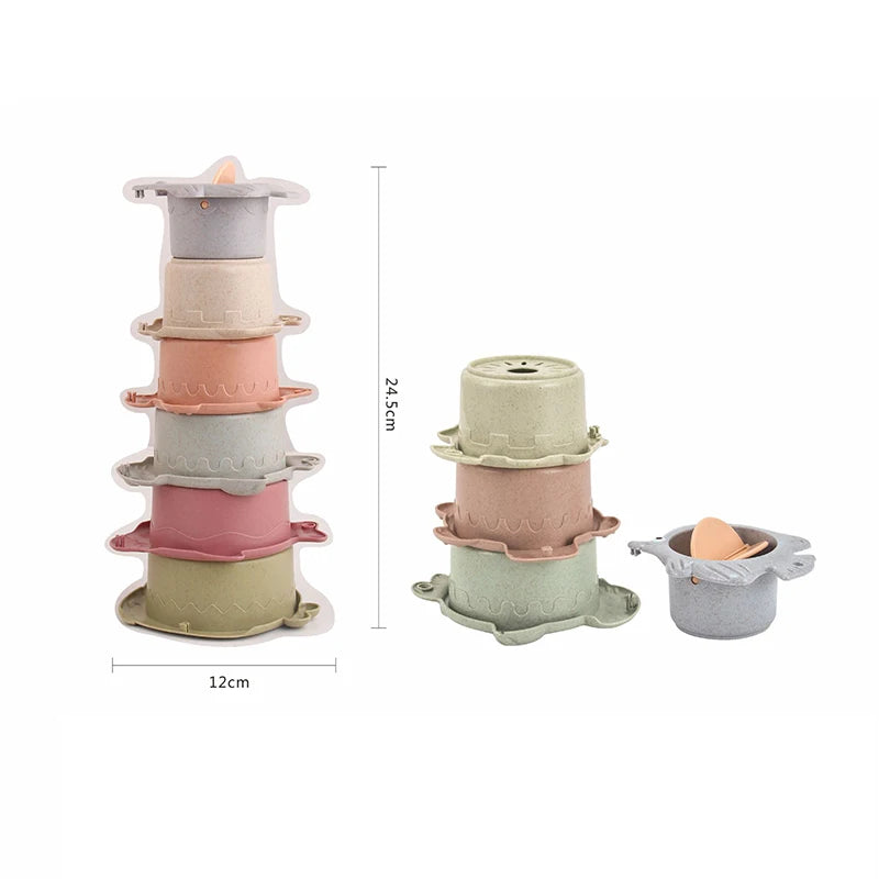 A set of boat-shaped stacking cups bath toys in various pastel colors for toddlers.