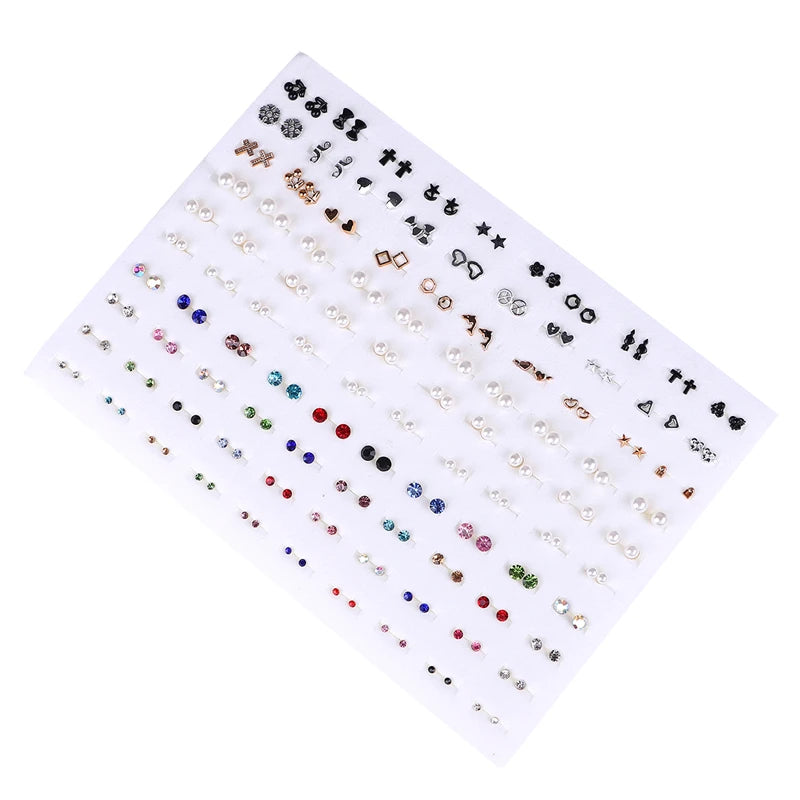A collection of assorted acrylic stud earrings featuring hearts, stars, moons, and other designs.
