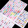 A collection of 100 pairs of assorted acrylic stud earrings featuring hearts, stars, and moons in various colors