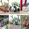 A set of animals and plants including a meerkat, panda, cat, zebra, and various succulents.