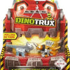 A Dinotrux toy truck car with removable dinosaur figures displayed in its packaging.