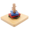 A wooden Montessori sensory toy set featuring a vertical wooden post and stacked colored blocks on a light wood base.