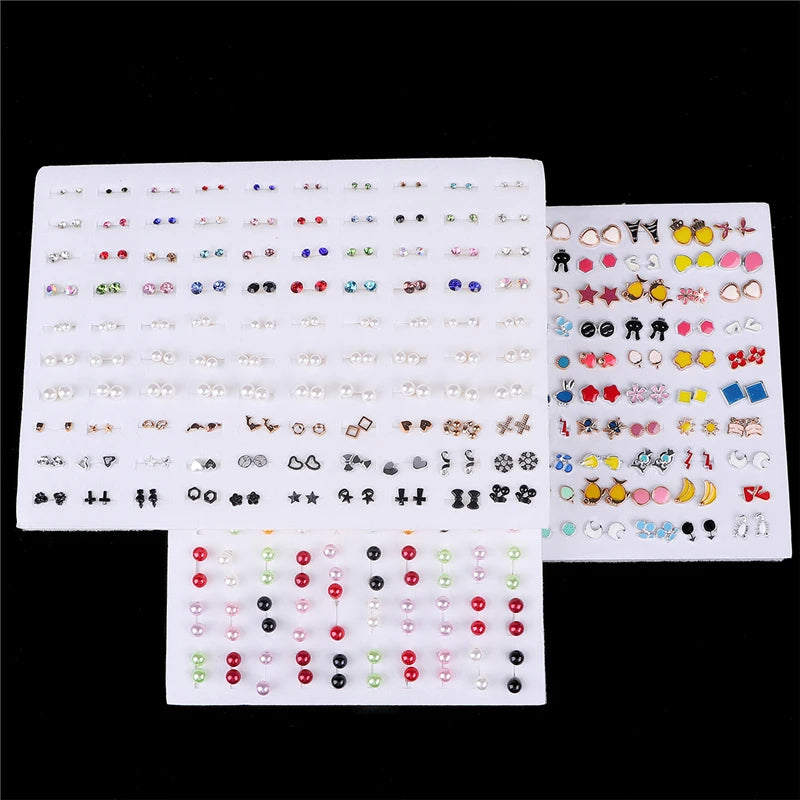A collection of assorted acrylic stud earrings featuring hearts, stars, moons, and other designs in various colors.