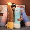 A collection of colorful long body stuffed animal plush pillows featuring various pastel colors and cute faces.