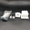 A complete candle making kit showing white wooden wicks, a pouring pot, and silicone fixators on a dark surface.