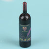 A dark glass bottle of Pelješac wine with a cork, labeled Putnikovici and Pelješac.