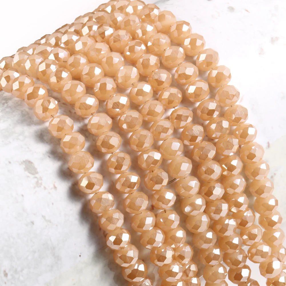 A string of faceted, light amber crystal glass beads for jewelry making