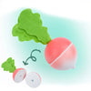 A magnetic wooden fruit and vegetable cutting toy set showing a green leaf attached to a pink spherical fruit.