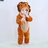 A baby wearing an adorable orange lion hooded romper and holding a piece of food.