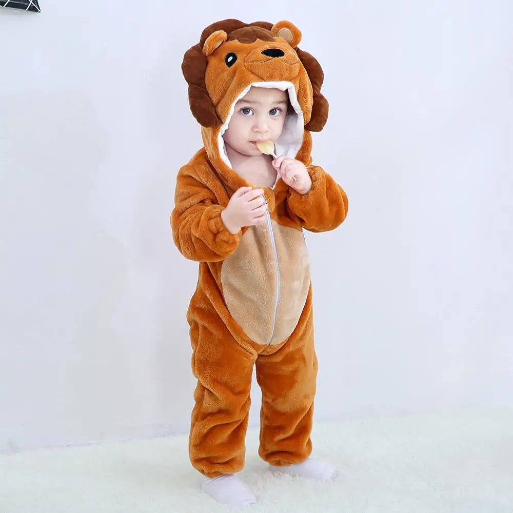 A baby wearing an adorable orange lion hooded romper and holding a piece of food.